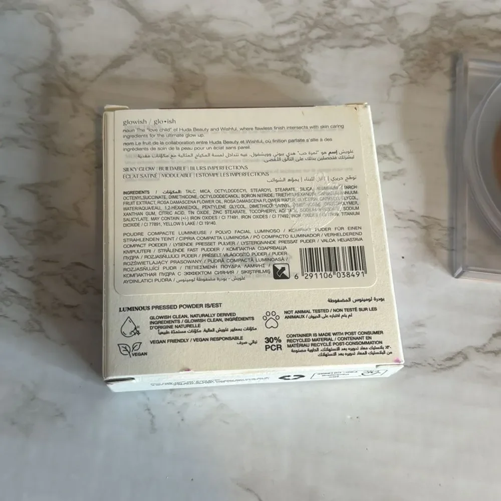 HUDA BEAUTY GloWish luminous Vegan pressed Powder in 10 deep tan